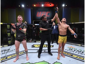 LAS VEGAS, NEVADA - NOVEMBER 14: In this handout image provided by UFC, Rafael Dos Anjos of Brazil reacts after his victory over Paul Felder in a lightweight fight during the UFC Fight Night event at UFC APEX on November 14, 2020 in Las Vegas, Nevada.