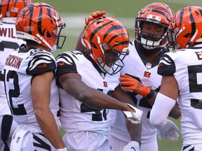 Brandon Wilson, centre, and Alex Erickson, left, of the Cincinnati Bengals celebrate with teammates after a defensive play against the Tennessee Titans in the third quarter of the game at Paul Brown Stadium on Nov. 1, 2020 in Cincinnati, Ohio.