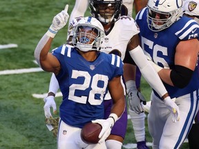 Jonathan Taylor of the Indianapolis Colts celebrates a touchdown against the Baltimore Ravens during the first quarter at Lucas Oil Stadium on November 08, 2020 in Indianapolis, Indiana.