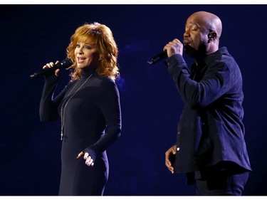 Reba McEntire and Darius Rucker perform onstage at Nashville's Music City Center for "The 54th Annual CMA Awards" broadcast on Wednesday, Nov. 11, 2020 in Nashville, Tennessee.