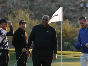 Phil Mickelson and Charles Barkley celebrate defeating Stephen Curry and Peyton Manning 4&3 on the 15th green during Capital One's The Match: Champions For Change at Stone Canyon Golf Club on Nov. 27, 2020 in Oro Valley, Ariz.