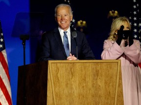 U.S. Democratic presidential nominee and former Vice President Joe Biden speaks next to his wife Jill following early results from the 2020 U.S. presidential election in Wilmington, Delaware, Nov. 4, 2020.