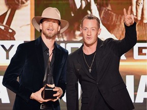 Singers Brian Kelley (L) and Tyler Hubbard of Florida Georgia Line accept Favorite Country Duo or Group onstage during the 2016 American Music Awards at Microsoft Theater on November 20, 2016 in Los Angeles, California.