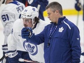 Sheldon Keefe, chatting with Auston Matthews during a practice, says motivation is a personal thing and that he doesn’t rely on “just one communication style.”