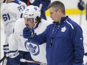 Sheldon Keefe and Auston Matthews talk at Toronto Maple Leafs practice at the Ford Performance Centre in Toronto on Monday November 25, 2019.