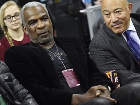 Former New York Knicks player Charles Oakley, left,  attends the game between the Cleveland Cavaliers and the New York Knicks  at Quicken Loans Arena in Cleveland, Ohio, Feb. 23, 2017.