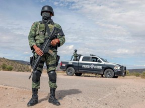 Members of the National Guard stand guard near La Morita ranch, belonging to the Mexican-American LeBaron family in Bavispe, Sonora state, Mexico, on Nov. 6, 2019.