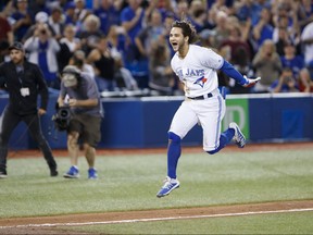 Blue Jays’ Bo Bichette leaps as he head to home plate after hitting a game-winning home run in the 12th inning against the New York Yankees on Sept. 13, 2019 in Toronto. The shortstop is viewed by the organization as a likely Gold Glove winner in the years to come.