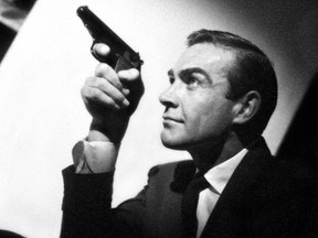 Sean Connery as secret agent James Bond holds a Walther PP, the first gun used by Bond in a still from the film Dr. No, made in 1962.