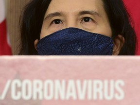 Chief Public Health Officer Dr. Theresa Tam wears a mask as she waits to answer questions as an update is provided during the COVID pandemic in Ottawa on Tuesday, Nov. 3, 2020.