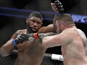 Curtis Blaydes (left) fights  Daniel Omielanczuk at UFC 213, Saturday, July 8, 2017, in Las Vegas.