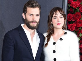 Jamie Dornan (left) and Dakota Johnson attend the "Fifty Shades of Grey" New York Fan First screening at Ziegfeld Theatre on February 6, 2015 in New York.