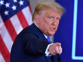 U.S. President Donald Trump gestures after speaking during election night in the East Room of the White House in Washington, D.C., in the early morning hours of Nov. 4, 2020.