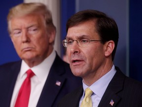 U.S. President Donald Trump listens to Secretary of Defense Mark Esper address the daily White House coronavirus response briefing with members of the administration's coronavirus task force at the White House in Washington, D.C., March 18, 2020.