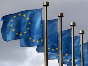 European Union flags flutter in front of the European Commission headquarters in Brussels, Belgium, Oct. 2, 2019.