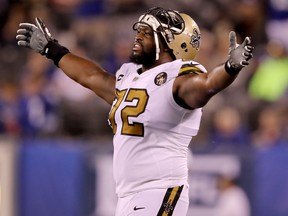 Terron Armstead of the New Orleans Saints celebrates after the ruling on the field confirmed fumble recovery by the Saints in the fourth quarter against the New York Giants on September 30,2018 at MetLife Stadium in East Rutherford, New Jersey.