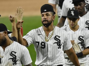 Jose Abreu and teammates of the Chicago White Sox celebrate the team win against Chicago Cubs at Guaranteed Rate Field on Sept. 26, 2020 in Chicago, Ill.