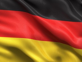 Silky flag of Germany waving in the wind with highly detailed fabric texture.