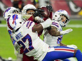 Arizona Cardinals wide receiver DeAndre Hopkins (centre) catches a Hail Mary pass for a touchdown in the closing seconds of the game against the Buffalo Bills at State Farm Stadium.