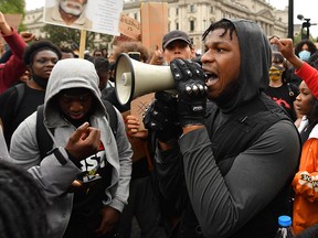 John Boyega speaks to the crowd during a Black Lives Matter protest in Hyde Park on June 3, 2020 in London.