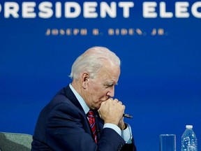 U.S. President-elect Joe Biden listens as he holds a videoconference meeting with members of the U.S Conference of Mayors at his transition headquarters in Wilmington, Delaware, Monday, Nov. 23, 2020.
