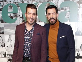 Jonathan Scott, left, and his brother Drew Scott, right, celebrate the premier Issue of New Meredith Corporation's lifestyle publication Reveal at Meredith, INC in New York City, Jan. 9, 2020.
