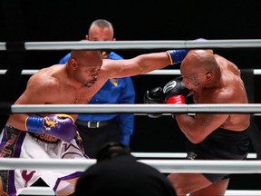 Mike Tyson (black trunks) fights Roy Jones, Jr. (white trunks) during a heavyweight exhibition boxing bout for the WBC Frontline Belt at the Staples Center in Los Angeles, Saturday, Nov. 28, 2020.