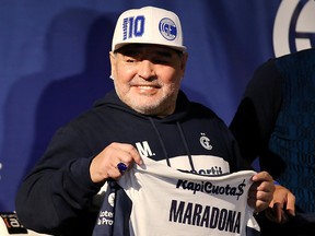 Diego Maradona smiles during his presentation as new coach of Gimnasia y Esgrima.