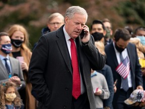 White House Chief of Staff Mark Meadows speaks on his phone as he waits for U.S. President Donald Trump to depart the White House in Washington, D.C., Oct. 30, 2020.
