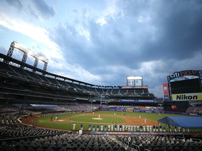 The Miami Marlins and the New York Mets players stand in the field in protest before walking out of a game at Citi Field.