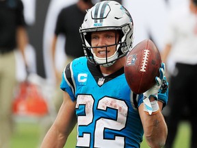 Christian McCaffrey of the Carolina Panthers celebrates after scoring a touchdown against the Tampa Bay Buccaneers at Raymond James Stadium on September 20, 2020 in Tampa, Florida.