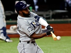 Tampa Bay Rays left fielder Randy Arozarena hits a single against the Los Angeles Dodgers during Game 6 of the 2020 World Series at Globe Life Field.