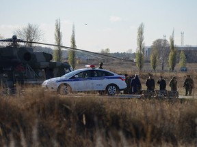 Russian military officials and investigators gather at a base after a conscript killed fellow servicemen in Voronezh Region, Russia November 9, 2020.