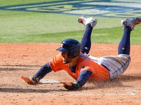 George Springer of the Houston Astros scores a run during Game 1 of the American League Division Series on Oct. 5. The Blue Jays have reportedly been in hot pursuit of the outfielder.