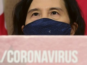 Chief Public Health Officer Dr. Theresa Tam wears a mask as she waits to answer questions as an update is provided during the COVID pandemic in Ottawa on Tuesday, Nov. 3, 2020.