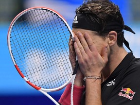 Austria's Dominic Thiem celebrates winning his semi-final match against Serbia's Novak Djokovic at the ATP Finals in London, Nov. 21, 2020.