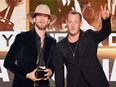 Brian Kelley (left) and Tyler Hubbard of Florida Georgia Line accept the award for Favorite Country Duo or Group during the 2016 American Music Awards at Microsoft Theater on November 20, 2016 in Los Angeles.