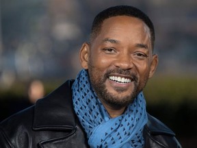 In this file photo taken on January 06, 2020 US actors Will Smith poses at the 'Bad Boys For Life' launching photocall in Paris, in front of the Eiffel Tower.