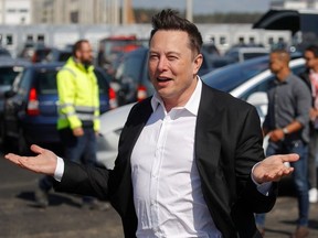 In this file photo taken on September 03, 2020, Tesla CEO Elon Musk arrives to visit the construction site of the future US electric car giant Tesla in Gruenheide near Berlin.