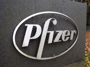 The Pfizer logo is seen at their UK commercial headquarters in Walton Oaks, Britain, November 11, 2020.
