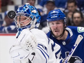 Maple Leafs goalie Frederik Andersen makes a save during a game against the Canucks in Vancouver. B.C.’s premier is calling on the feds to adopt his province’s inter-provincial travel ban.