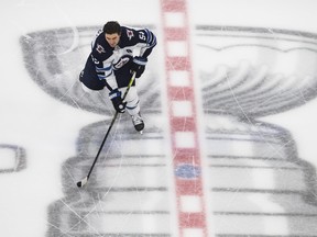 Jets’ Mark Scheifele warms up before Game 1 of his team’s playoff series against the Calgary Flames in Edmonton in August. Scheifele was injured just three shifts into the game, but he has returned to the ice and claims he’s at full health.