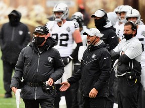 Raiders head coach Jon Gruden, left, watches from the sidelines during the first half of the NFL game against the Browns at FirstEnergy Stadium in Cleveland, Sunday, Nov. 1, 2020.