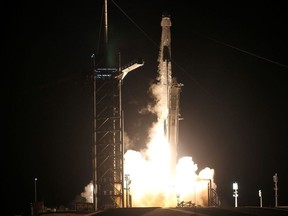 A SpaceX Falcon 9 rocket, topped with the Crew Dragon capsule, is launched carrying four astronauts on the first operational NASA commercial crew mission at Kennedy Space Center in Cape Canaveral, Florida, U.S. November 15, 2020.