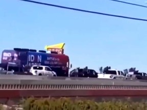 U.S. President Donald Trump retweeted a video of a convoy of vehicles flying Trump flags surrounding a bus carrying campaign staff for Democratic challenger Joe Biden on a Texas highway.