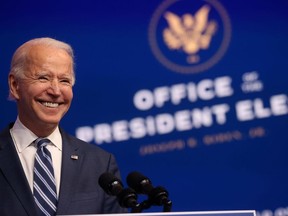 U.S. President-elect Joe Biden smiles as he speaks about health care and the Affordable Care Act (Obamacare) at the theater serving as his transition headquarters in Wilmington, Delaware, U.S., November 10, 2020.