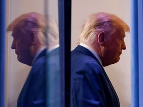U.S. President Donald Trump is reflected as he departs after speaking about the 2020 U.S. presidential election results in the Brady Press Briefing Room at the White House in Washington, U.S., November 5, 2020.