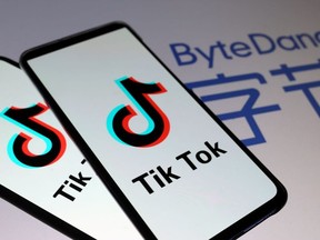 Tik Tok logos are seen on smartphones in front of a displayed ByteDance logo in this illustration taken November 27, 2019.