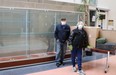 Lynn Philip Hodgson, left, removes the Camp X display from Durham Regional Headquarters after staff complaints over 'offensive' artifacts. Camp X was a top-secret spy school operated in Whitby during the Second World War.