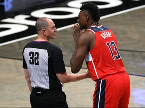In this Dec. 13, 2020 file photo, Thomas Bryant of the Washington Wizards pleads with referee Marat Kogut during the first half against the Brooklyn Nets at Barclays Center in the Brooklyn borough of New York City.